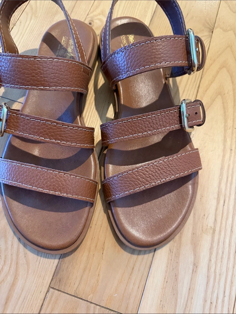Couch and Four brown sandals